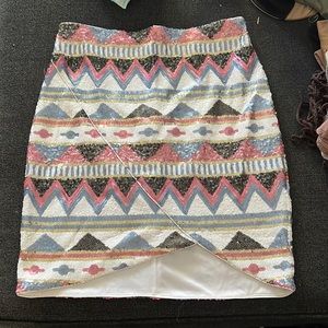 Bebe sequin skirt size Small but it fits more like a medium. Used about 2 times.